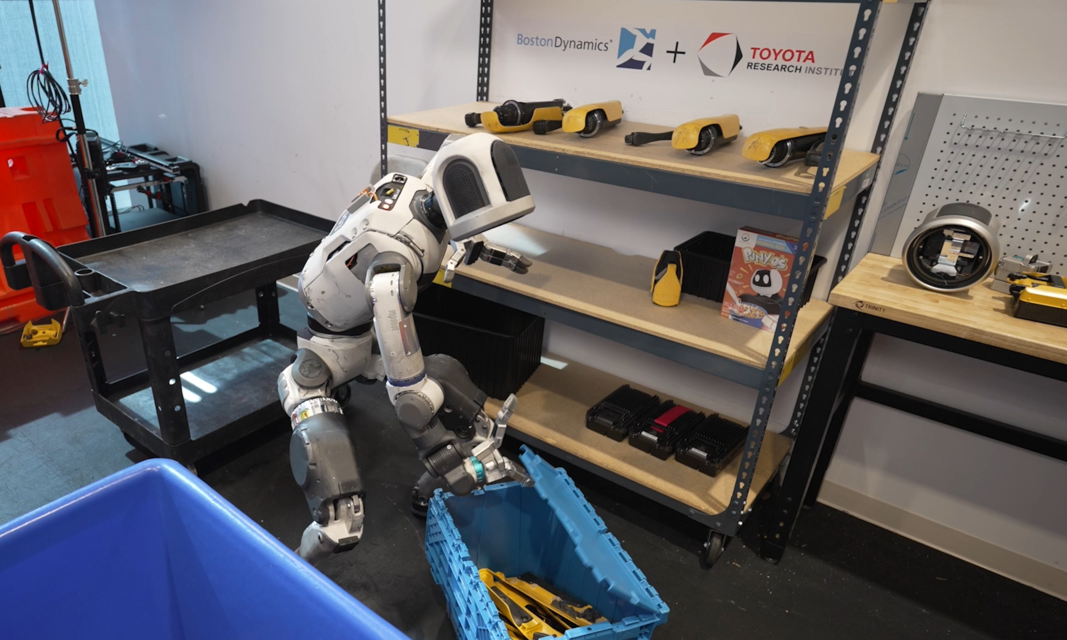 Boston Dynamics Atlas in promotional imagery from the company's industrial humanoid lineup. Hyundai's full-ownership bid targets factory and logistics scale-up, not a home companion robot.