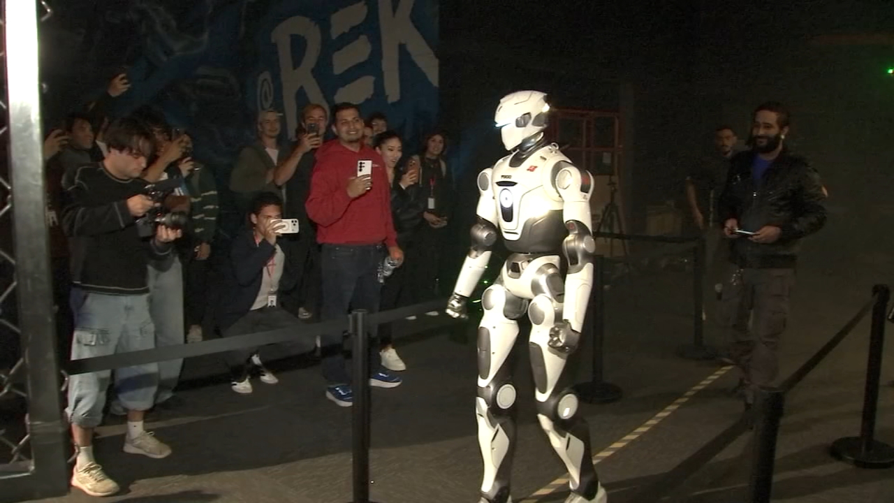 REK's six-foot humanoid robots demonstrated inside the new San Francisco storefront.
